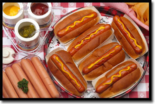 Hot dogs on a picnic table